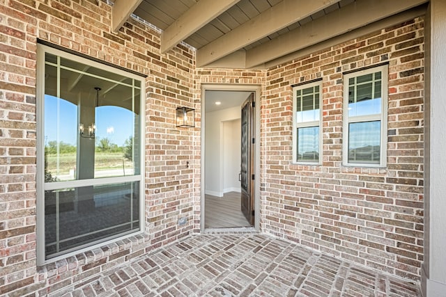 entrance to property featuring a patio area