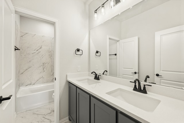 full bathroom with vanity, toilet, and tiled shower / bath combo