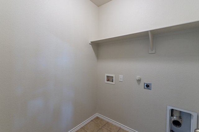 washroom with light tile patterned floors, hookup for a washing machine, hookup for an electric dryer, and hookup for a gas dryer