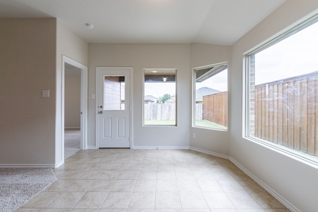 unfurnished room featuring light tile patterned flooring