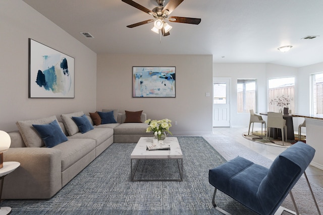 tiled living room featuring ceiling fan