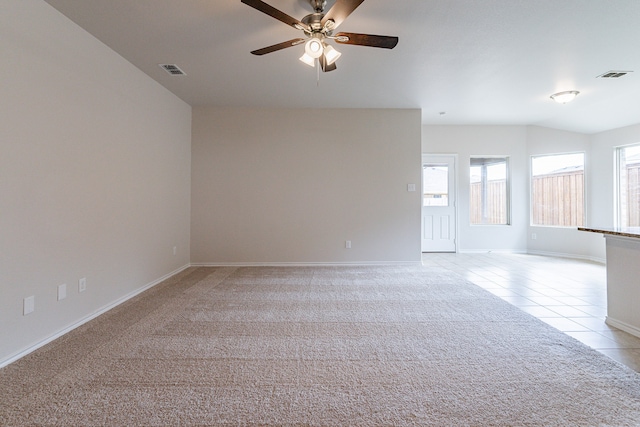 carpeted empty room with ceiling fan