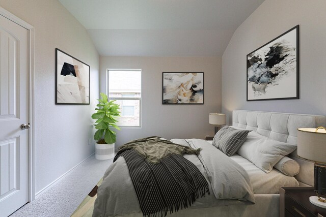 bedroom with lofted ceiling and carpet floors