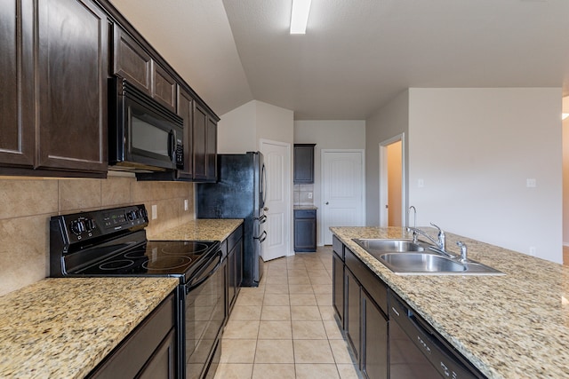 kitchen with light tile patterned floors, dark brown cabinets, backsplash, black appliances, and sink