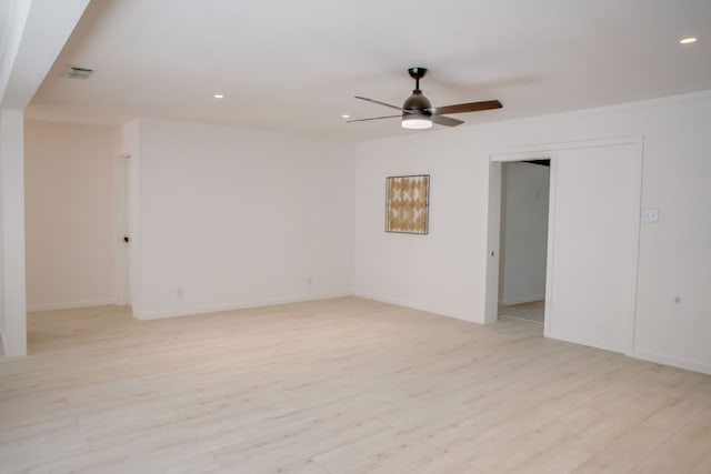 unfurnished room with ceiling fan and light hardwood / wood-style floors