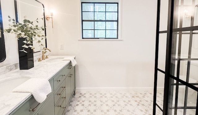 bathroom featuring tile patterned floors and vanity