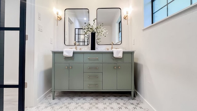 bathroom featuring tile patterned floors, double vanity, and crown molding