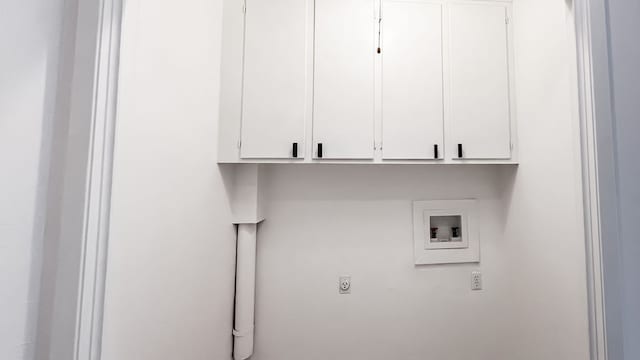 washroom featuring cabinets, washer hookup, and electric dryer hookup