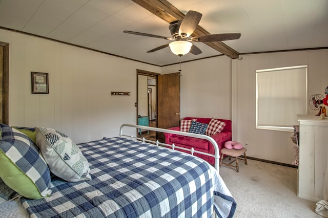 carpeted bedroom with crown molding and ceiling fan