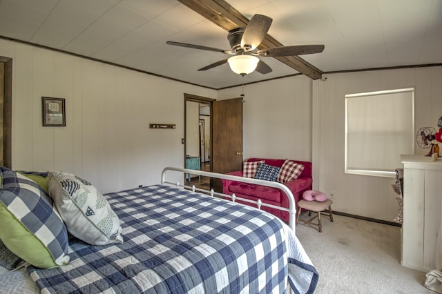 bedroom featuring ceiling fan, carpet floors, and ornamental molding