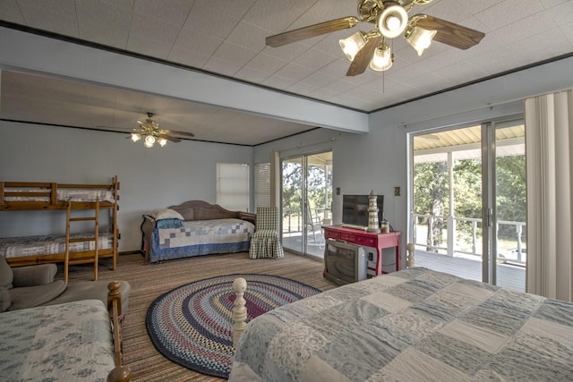 carpeted bedroom featuring ceiling fan, crown molding, and access to outside