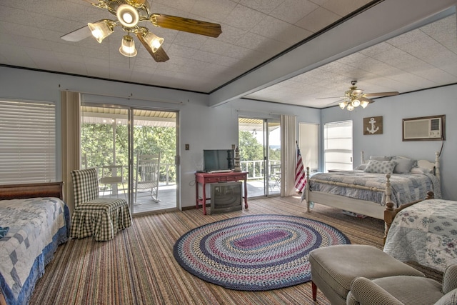 carpeted bedroom featuring access to exterior, a ceiling fan, and a wall unit AC