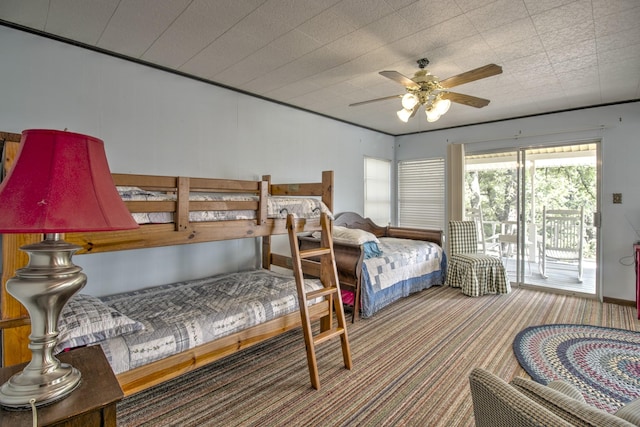 bedroom with access to exterior, carpet flooring, and ceiling fan