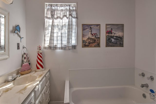 full bath featuring a bathing tub and vanity