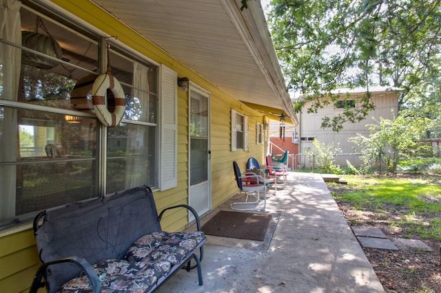 view of patio featuring fence