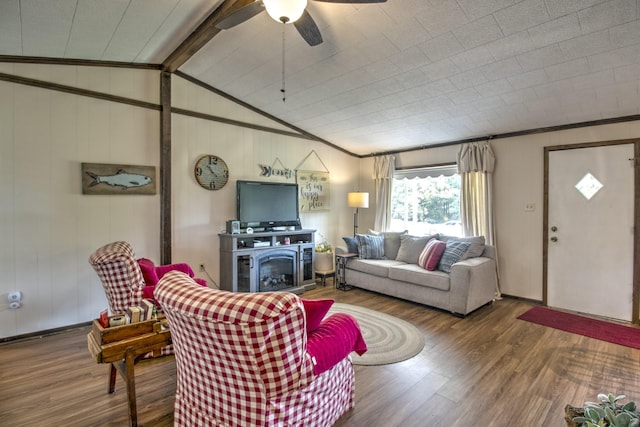 living area with crown molding, wood finished floors, a ceiling fan, and vaulted ceiling