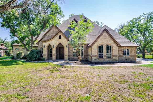 french country home with a front yard