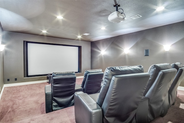 carpeted cinema featuring a textured ceiling