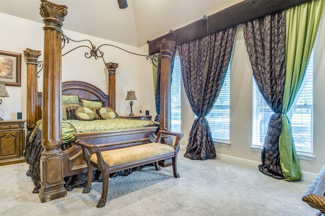 carpeted bedroom featuring lofted ceiling