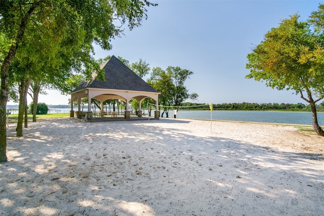 view of home's community featuring a gazebo, volleyball court, and a water view