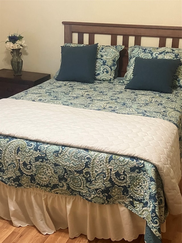 bedroom featuring hardwood / wood-style floors