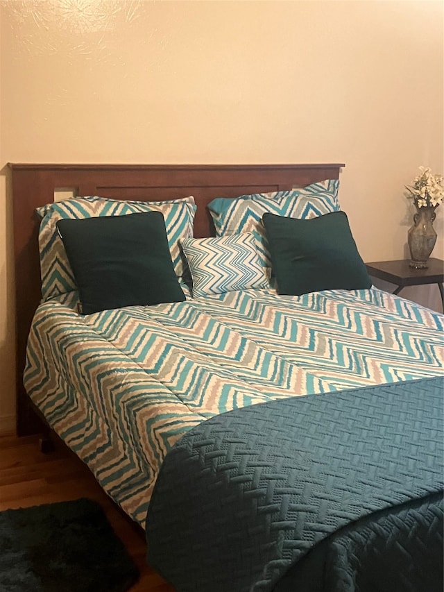 bedroom featuring wood-type flooring