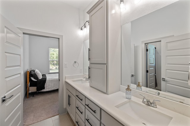 bathroom with tile patterned flooring and vanity