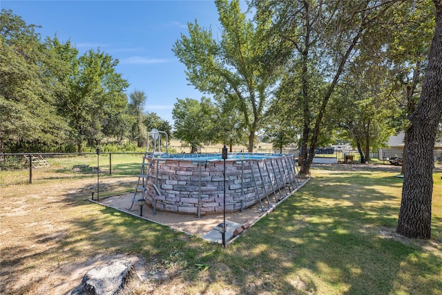 exterior space with a yard and a pool