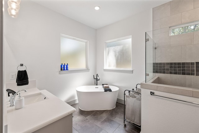 bathroom featuring separate shower and tub and vanity