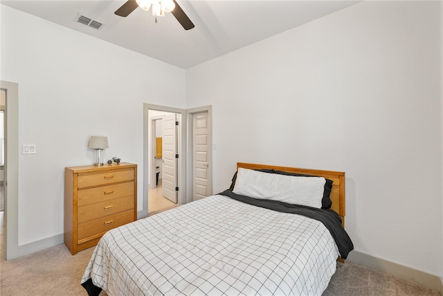 bedroom with ceiling fan and light carpet