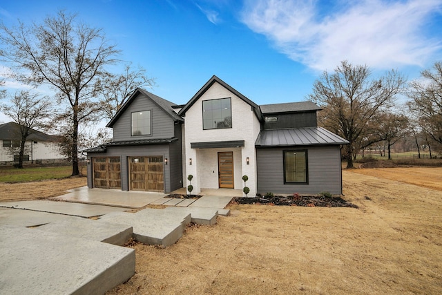 modern farmhouse style home with a garage