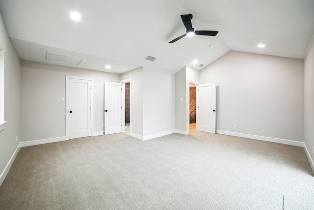 carpeted empty room featuring lofted ceiling and ceiling fan