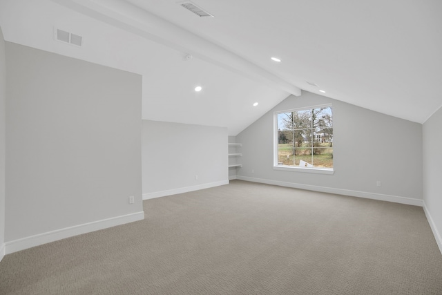 additional living space featuring light colored carpet, built in features, and vaulted ceiling with beams