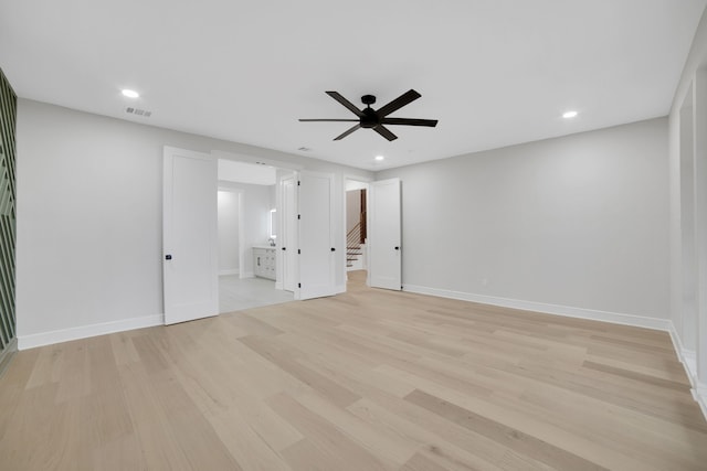 interior space with ceiling fan and light wood-type flooring