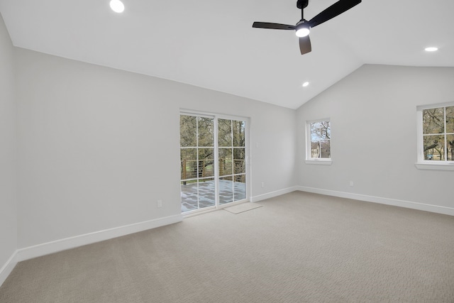 unfurnished room featuring carpet floors, ceiling fan, and vaulted ceiling