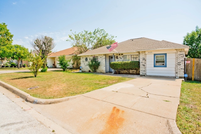 single story home with a front lawn