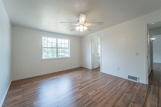 spare room featuring ceiling fan and wood-type flooring