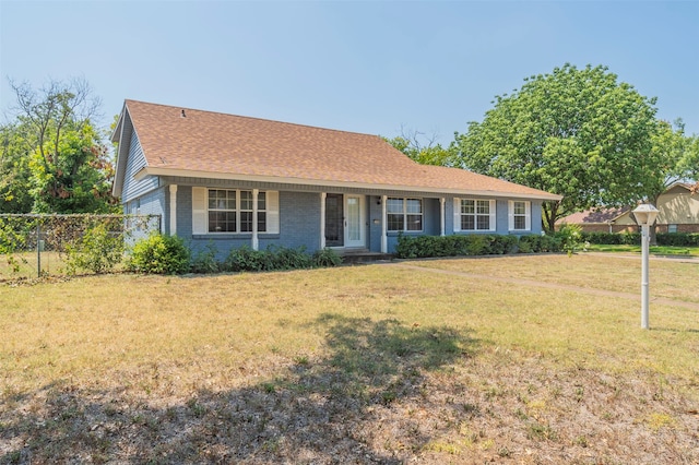 ranch-style house featuring a front lawn