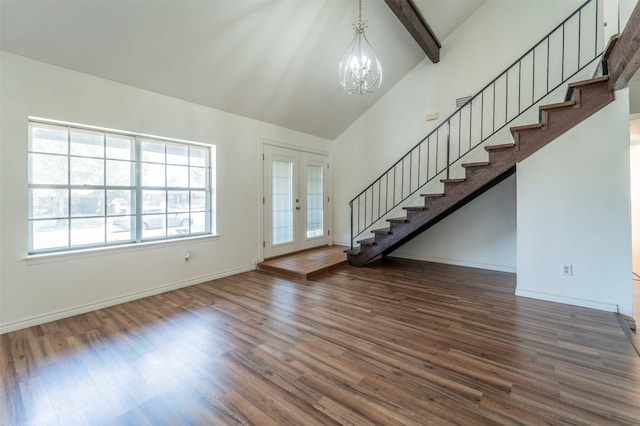 interior space with wood-type flooring, a chandelier, and vaulted ceiling with beams