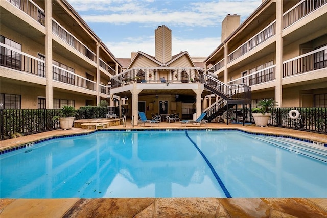 view of swimming pool featuring a patio area