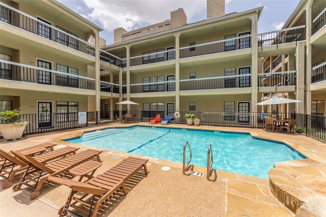 view of swimming pool with a patio