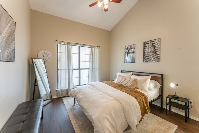 bedroom featuring ceiling fan, dark wood-type flooring, and high vaulted ceiling