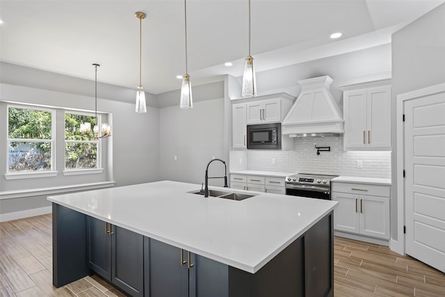 kitchen with tasteful backsplash, electric stove, black microwave, sink, and custom range hood