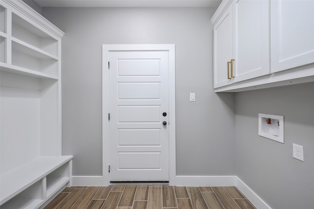 washroom with cabinets and hookup for a washing machine