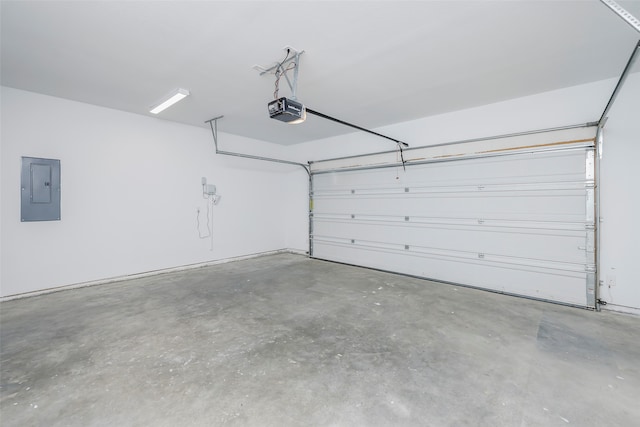 garage with electric panel and a garage door opener