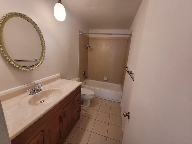 full bathroom with tiled shower / bath, vanity, toilet, and tile patterned flooring