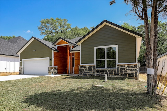 view of front of property with a front lawn and a garage