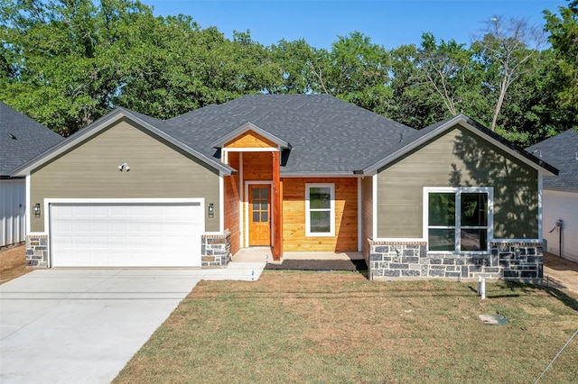 view of front of house with a front lawn and a garage