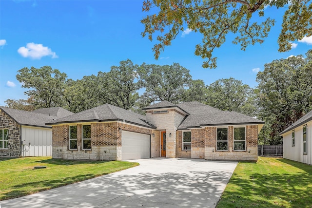 view of front facade with a front lawn and a garage