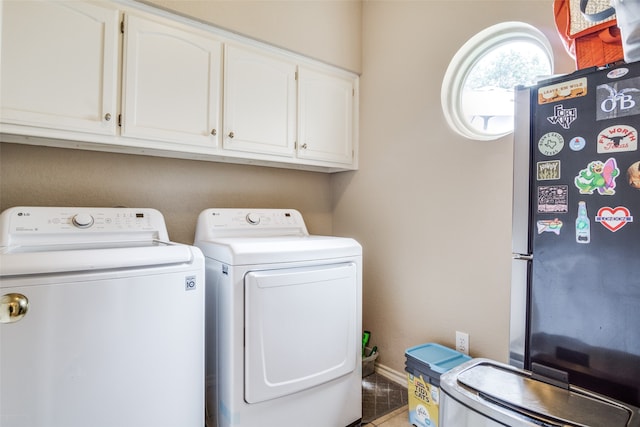 laundry room with separate washer and dryer and tile patterned flooring